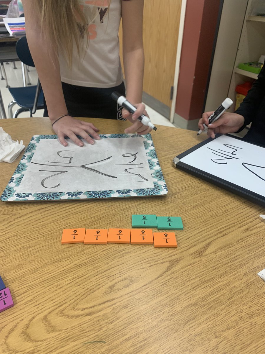 Today’s small groups focused on comparing fractions using fraction strips <a href="/CMSroomC52/">Ms. Figueiredo and Mrs. Roselle</a> #thisiscms