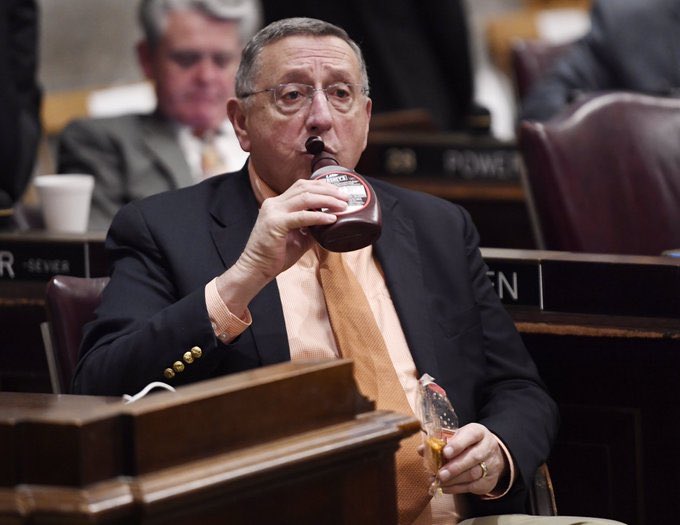 ampol_moment's tweet image. Tennessee State Rep. Kent Calfee takes a swig from a hershey's syrup bottle while waiting for the governor's speech to begin (2020)