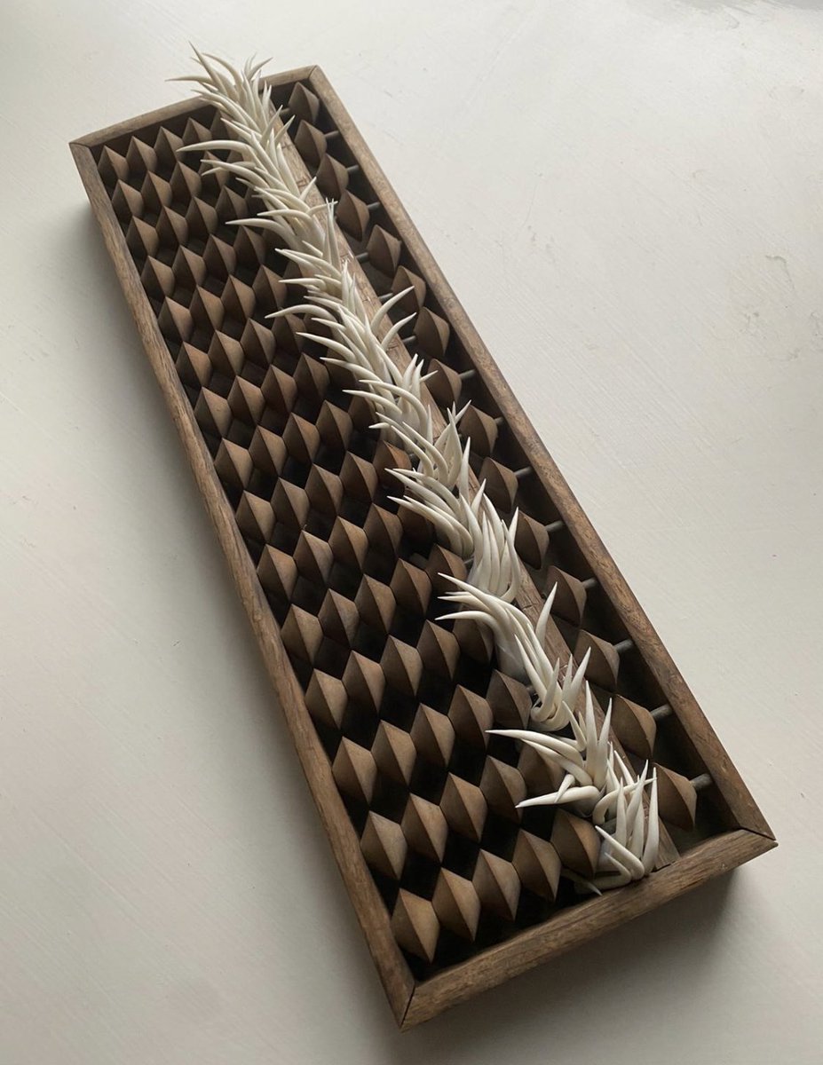Abacus &amp; Ruler by Ikuko Iwamoto, both objects known for order, used for measuring &amp; counting have been disrupted by her porcelain spikes that appear to block the passages, growing around the wooden elements as if they are sprouting roots from within. Uneasy beauty