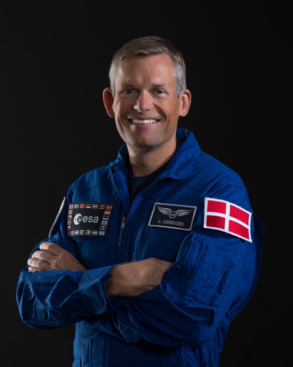 Portrait of Danish ESA astronaut Andreas Mogensen in his blue flight suit