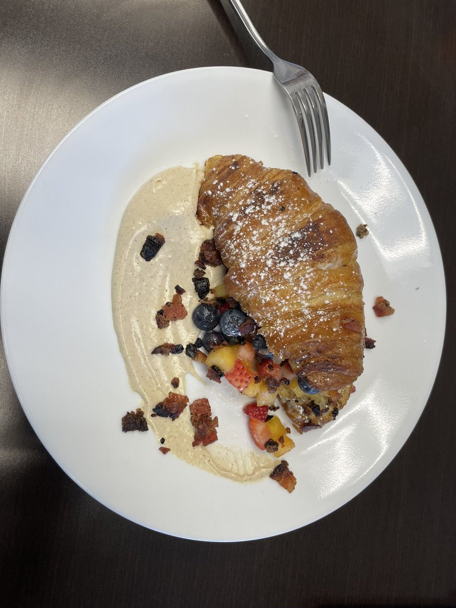 Culinary Arts treated us to French toasted croissant with caramelized fruit, and cream sauce, topped with candied bacon. 🤤