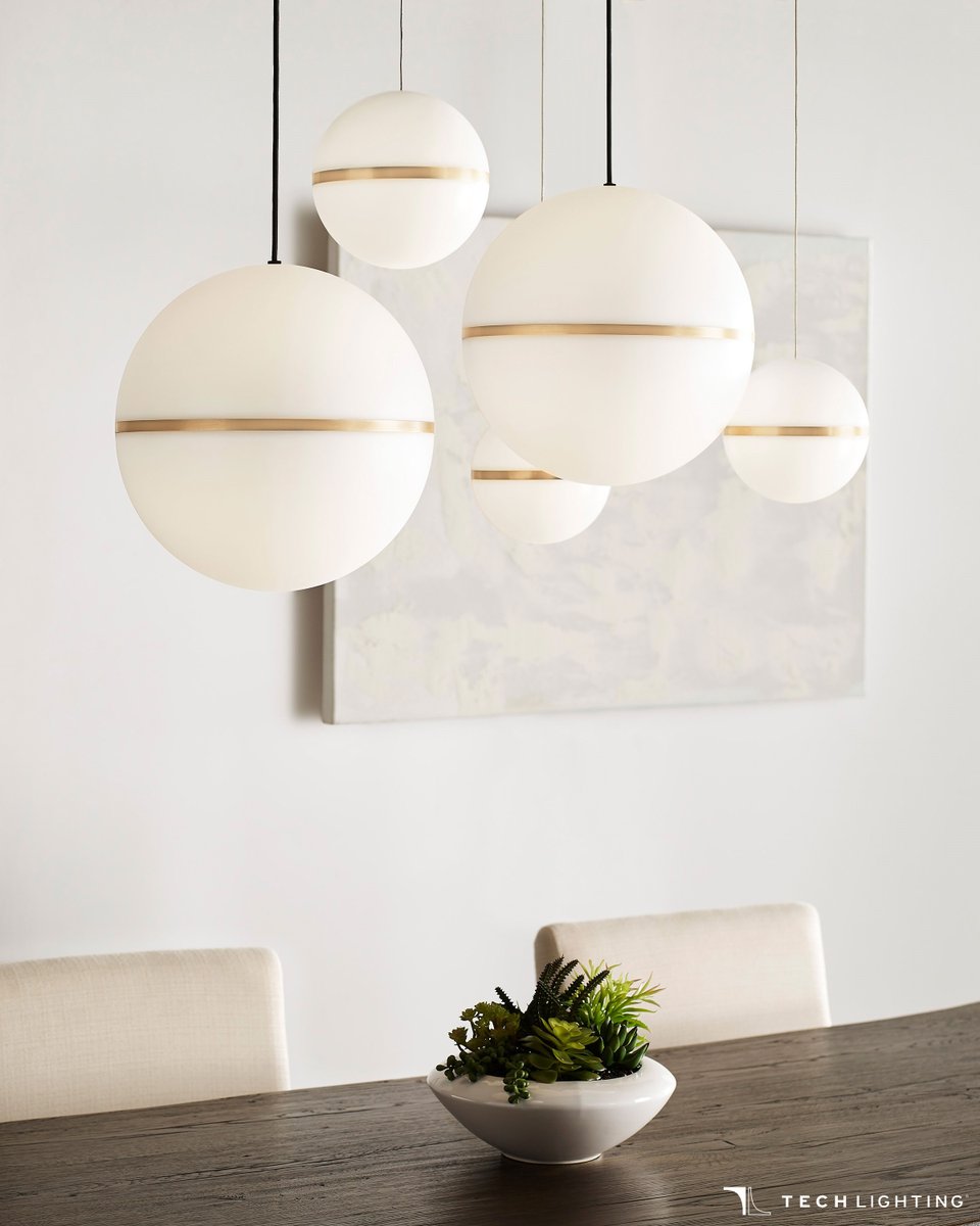 The Hanea series of pendants from Tech Lighting are inspired by mid-century design, with acrylic shades accented by a thin band offered in three finishes (Natural Brass, Nightshade Black, and Satin Nickel) and three diameters (7”, 14” and 18”).