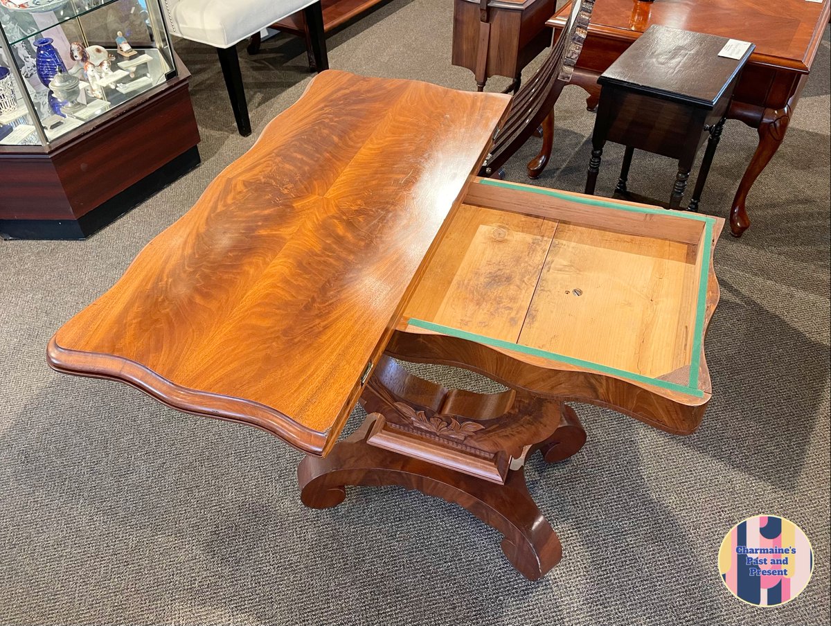 charmainesVic's tweet photo. A marvelous piece for a small space, this mahogany table's top swivels to reveal a handy little storage compartment and folds out into a surface that is perfect for an intimate meal or friendly game of cards! 
See more on our website: 
https://t.co/AJNUnsqleU

#charmaines https://t.co/4qozJKTGWv