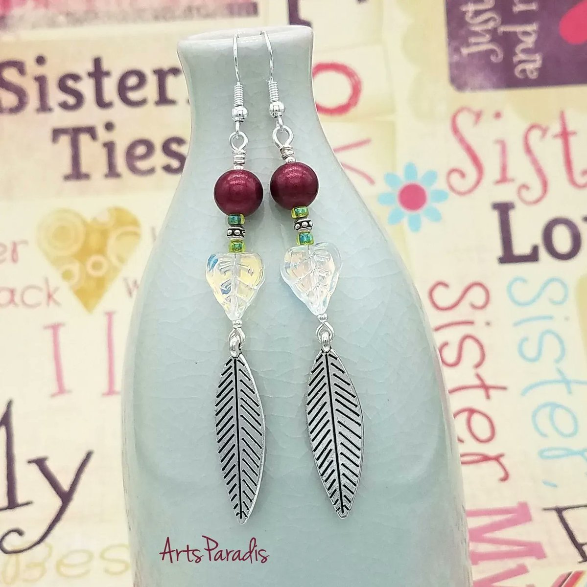 This design was inspired by a photo of a gorgeous orchid. It was so tall with just a pop of color at the top. What does this design remind you of?  ArtsParadis.com #handmadejewelry #womanowned #LGBTQowned #proudartist #springvibe #summerlook #leafmealone