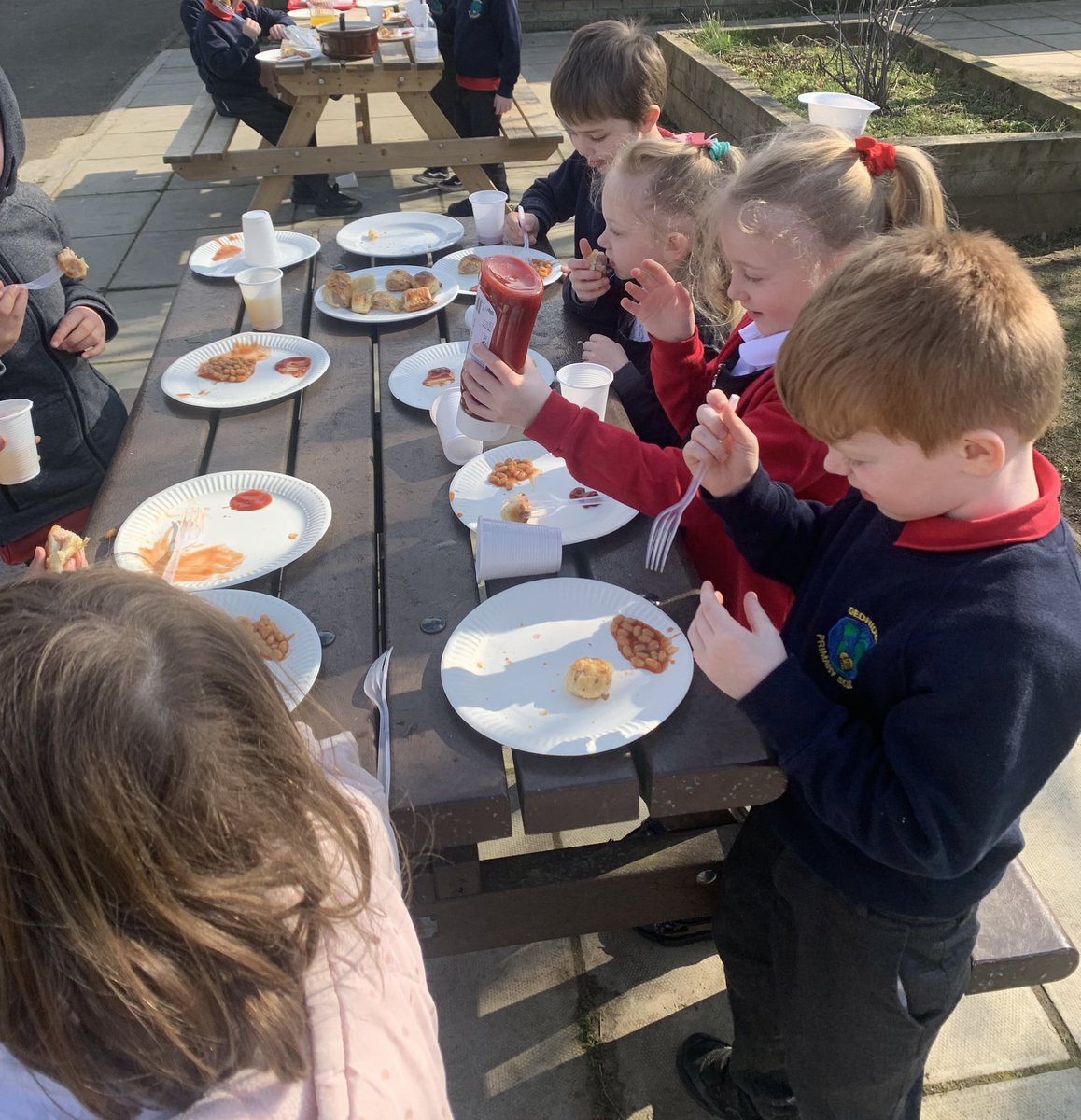 Eating our homemade sausage rolls outside in the sun 😀