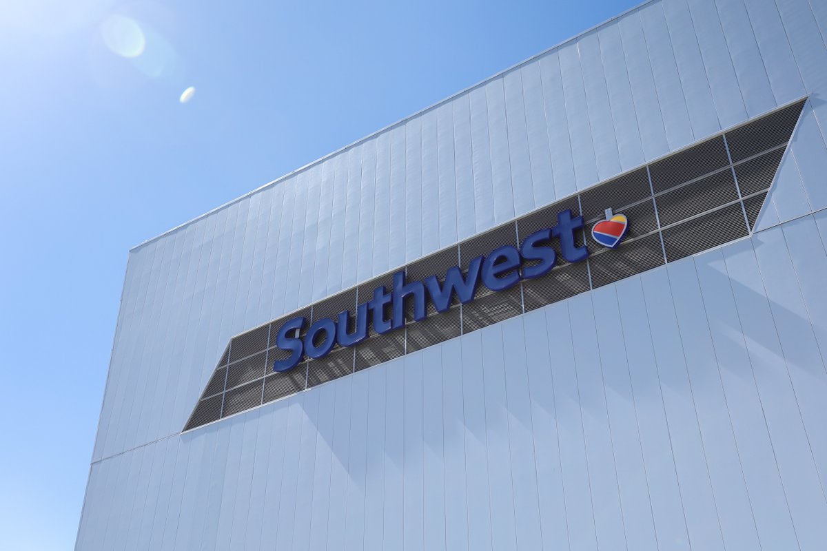 SouthwestAir's tweet photo. The ribbon’s been cut! We’re bringing more Heart to the Mile High City today with the opening of our new Technical Operations Hangar Facility at @DENAirport. #MileHighHeart https://t.co/Kvk421eqo1