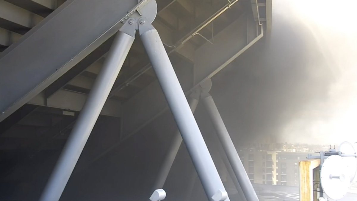 DoughertyKMGH's tweet photo. These are still pics from two of our cameras at Mile High.  You can see thick black smoke up on the concourse.  #MileHighFire https://t.co/Sx9xhoalB5