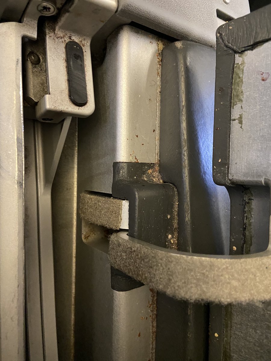 MaxPoritzky's tweet photo. Hey @AmericanAir flying  “First class” to go see my daughter and this plane is disgusting. This is what it looks like when you open the armrest tray table… so much for extra attention to cleanliness as we’re in a pandemic. So disappointing. https://t.co/iJdDi7uey1