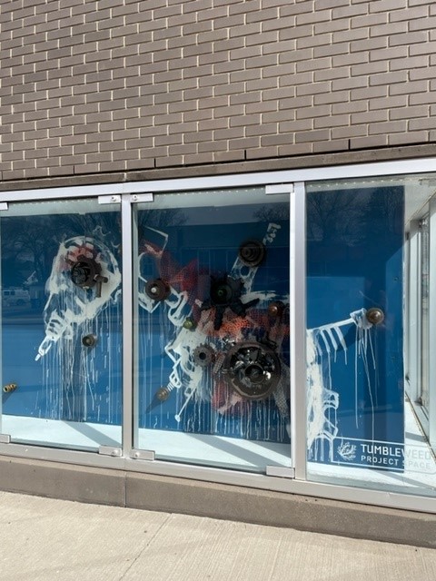 If you're out enjoying the Spring weather downtown, check out the Tumbleweed Project Space. On display now is 𝒐𝒓𝒊𝒈𝒊𝒏𝒂𝒕𝒆 / 𝒓𝒆𝒑𝒍𝒊𝒄𝒂𝒕𝒆, by Amy Duval. She has created a blueprint for a fictional world informed by the boneyard at Medalta. #medhat
