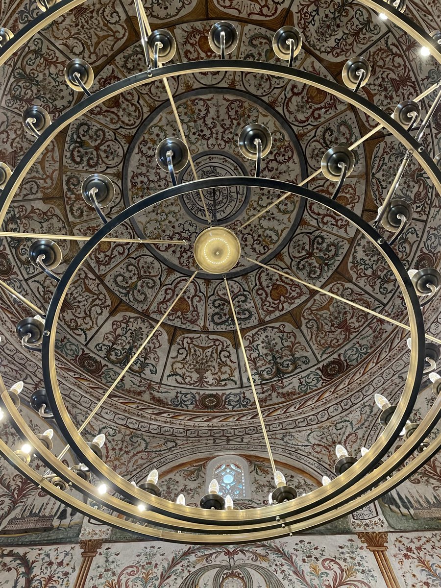 Looking up at the dome through the chandelier