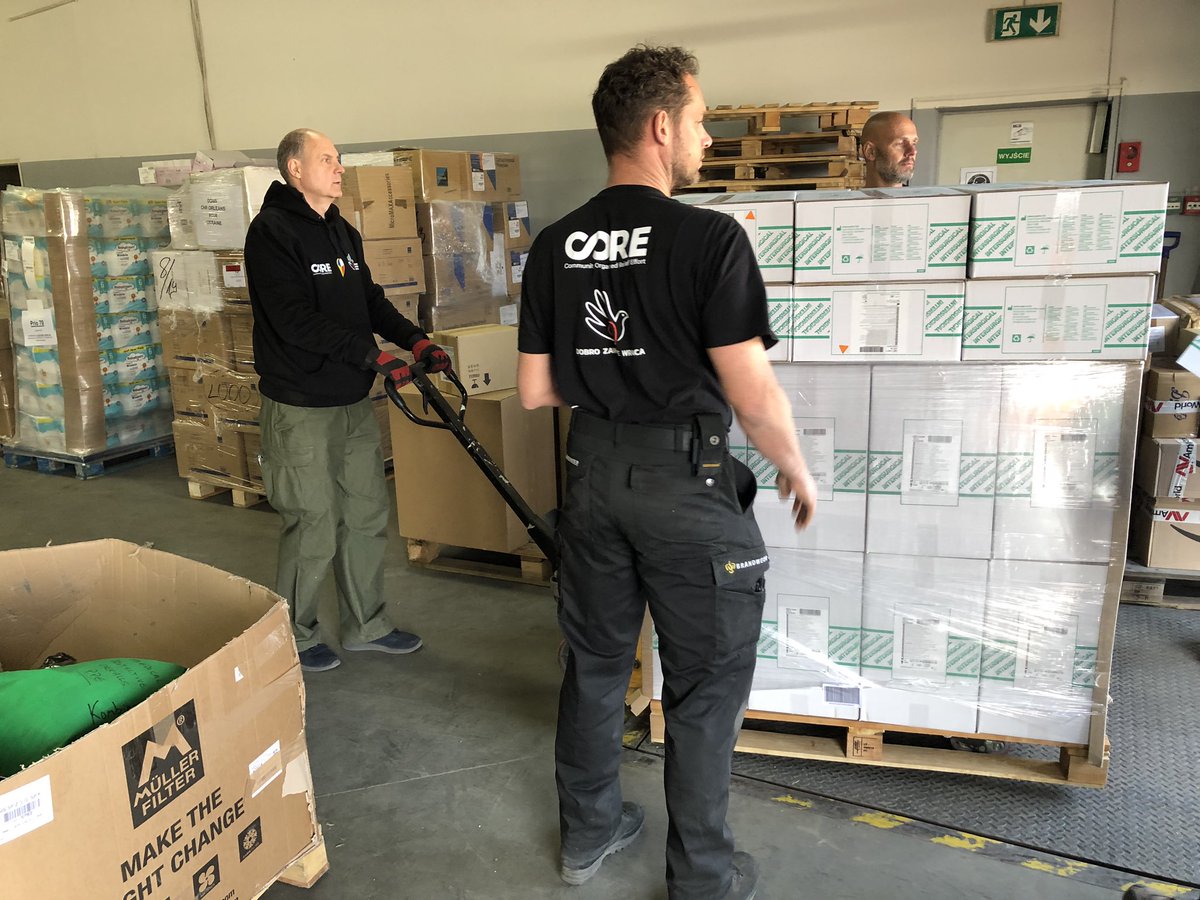 UkraineDash's tweet photo. Just completed the drop. Because we had fairly specialised kit we were directed to this facility that is acting as a distribution hub. 

The guys helping us were volunteers from the Dutch fire service, all great blokes. Thanks guys!. @OmologatoOro @BrandweerNederl https://t.co/sv8Wm9At9n