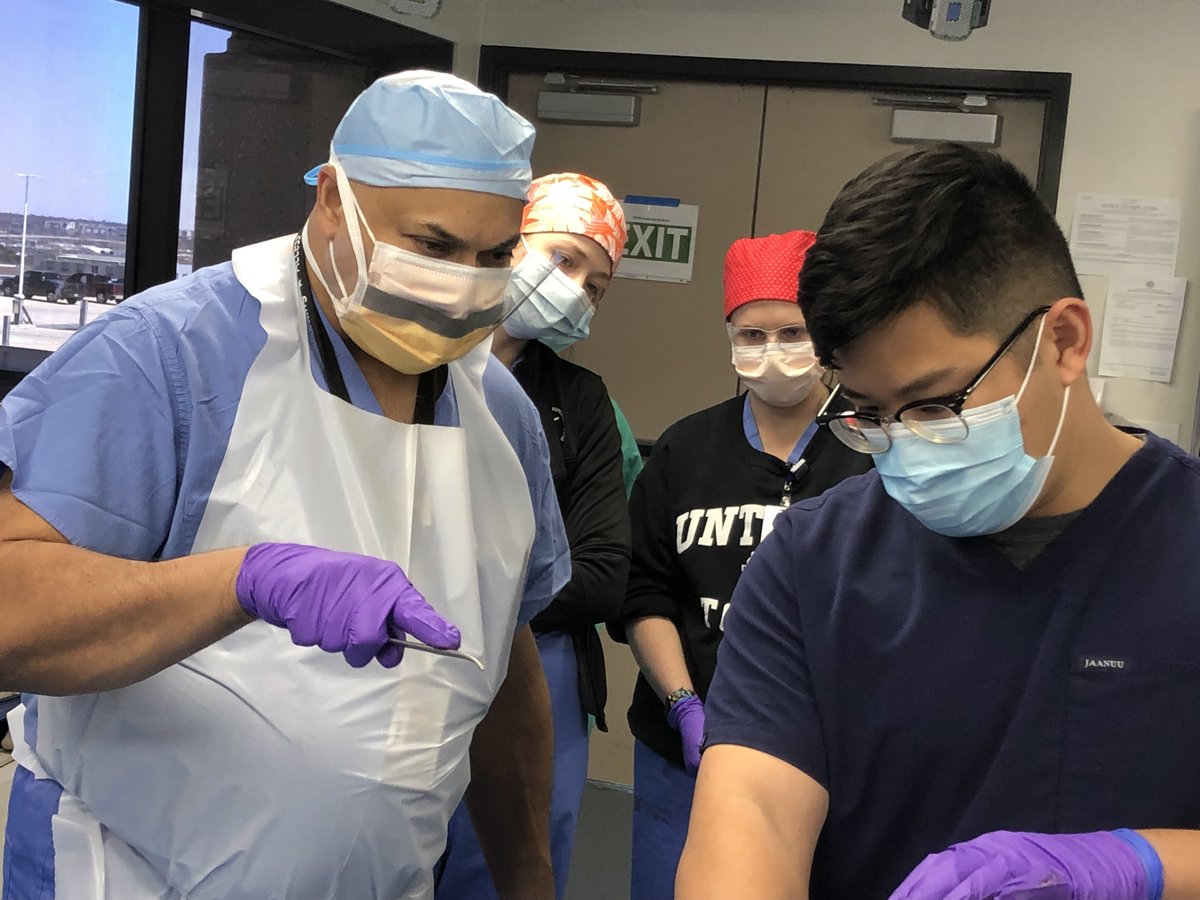 UNTHealth_TCOM's tweet photo. A unique opportunity for #TCOM fourth-year students to train in the @UNTHSC Anatomy Lab. @JPS_Health surgeon Dr. Rajesh Gandhi worked with recently matched students, many going into surgery & emergency medicine, on proper surgical techniques before they head off to residency. https://t.co/ux2OjZexIY