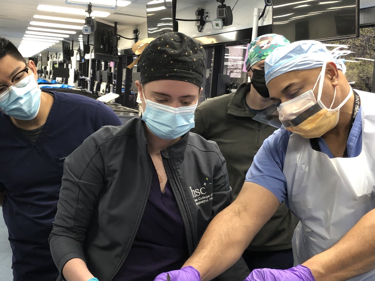 UNTHealth_TCOM's tweet photo. A unique opportunity for #TCOM fourth-year students to train in the @UNTHSC Anatomy Lab. @JPS_Health surgeon Dr. Rajesh Gandhi worked with recently matched students, many going into surgery & emergency medicine, on proper surgical techniques before they head off to residency. https://t.co/ux2OjZexIY