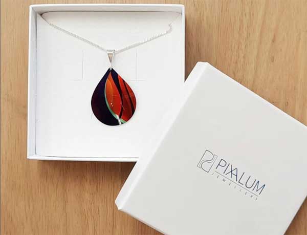 PinnerLocal's tweet photo. De'paul Jewellery - Mothers Day Not too late! Pop in to Pinner High St for the Stand out with the orange accent pendant by Pixalum. Handmade from printed aluminium and sterling silver. @PinnerAssociat @angieschemist  @PinnerBizClub @QueensHeadPinn https://t.co/xGxpdwg784 https://t.co/luyKC4qpCk
