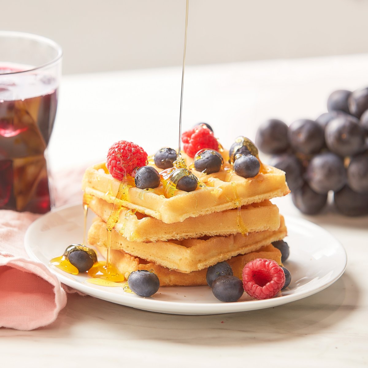 Welchs_UK's tweet photo. Itโs #NationalWaffleDay and who would love to tuck into this, this Friday? Syrupy waffles, fresh berries and a glass of our 100% Pure Purple Grape Juice! Perfect! ๐
#Waffletime #Waffles #ultimatebreakfast https://t.co/V0yhmMWlkf