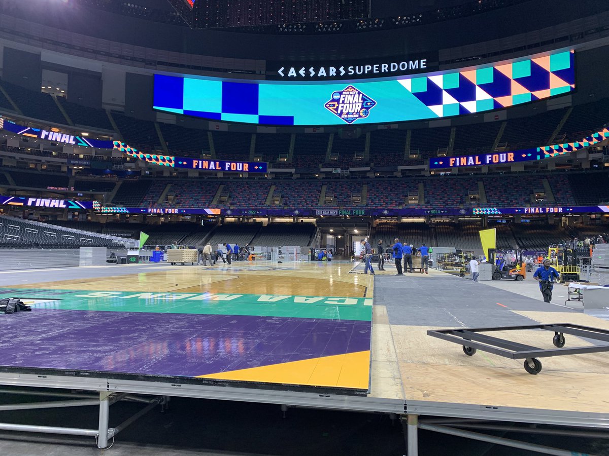 Workers installing the court for the Final Four at the Caesars Superdome today