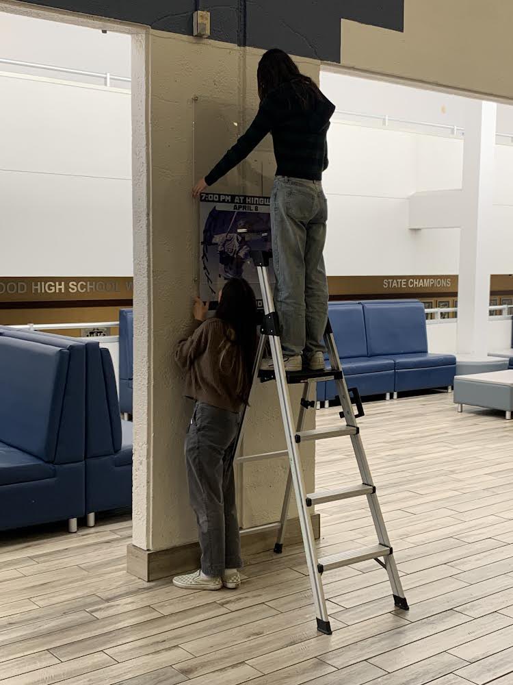 Hanging up sports posters in our cafeteria. The posters look awesome!  School spirit at its finest. <a href="/HumbleISD_KHS/">Kingwood High School</a> <a href="/HumbleISD_CTE/">Humble ISD CTE</a>