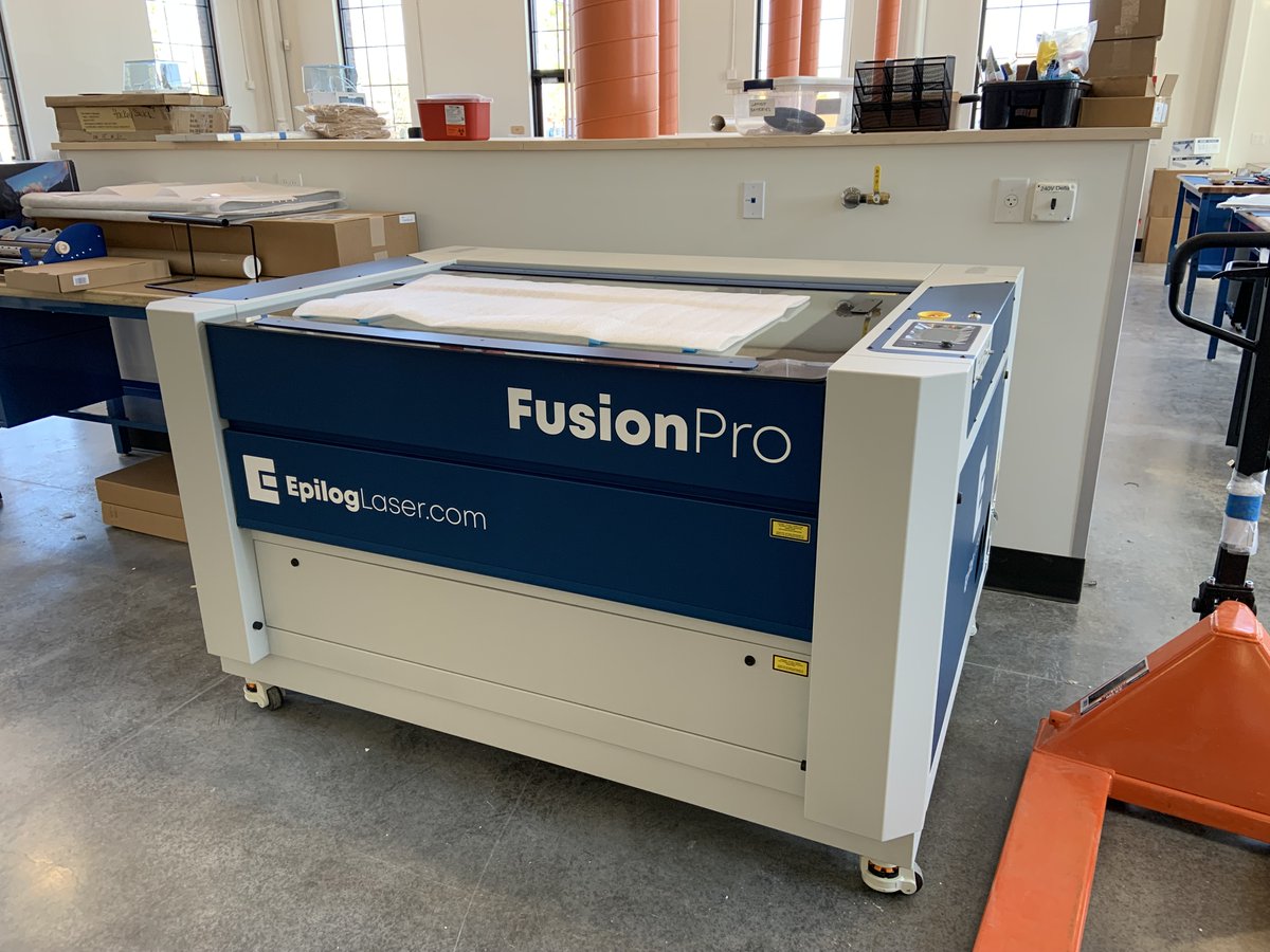 This weeks mystery crate contained a new Epilog dual source CO2 and Fiber laser with larger material surface area.