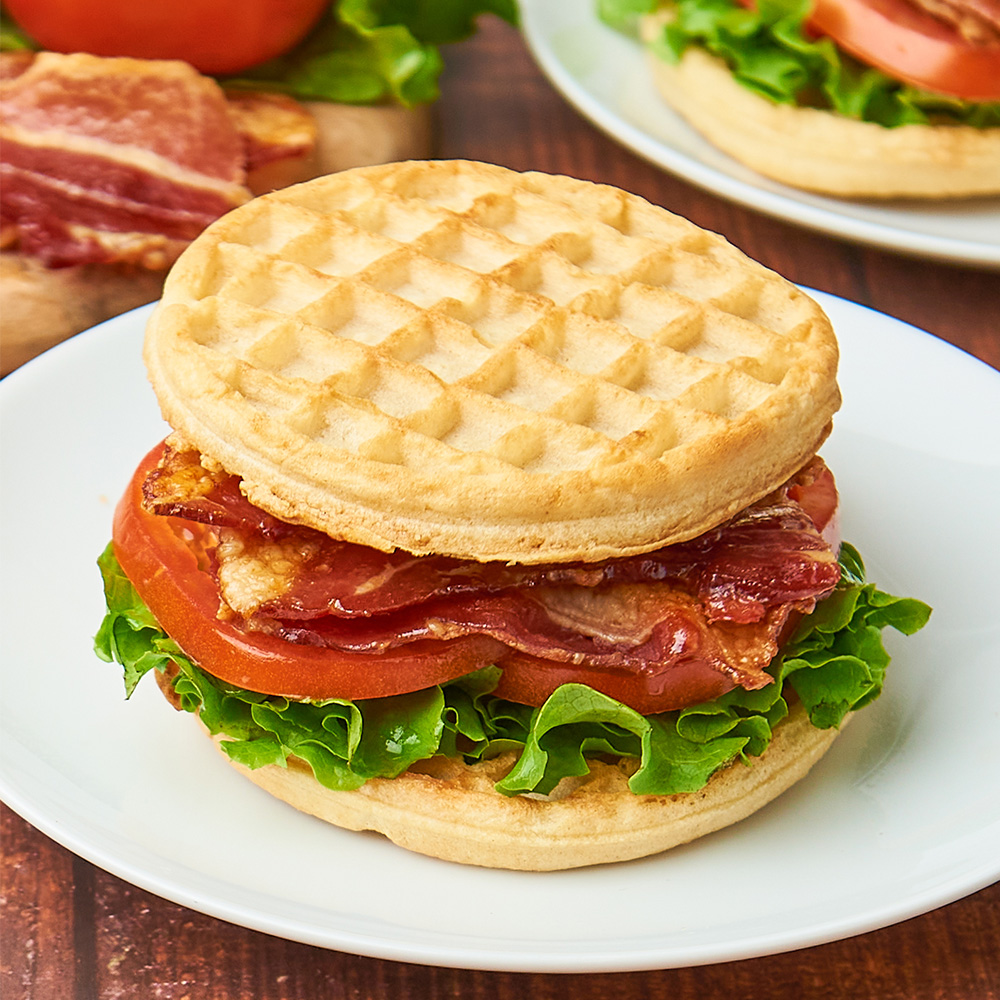 WBLT (Waffle Bacon Lettuce Tomato) doesn't have quite the same ring to it, but trust us: it's more delicious—especially on International Waffle Day. 🧇 🥓