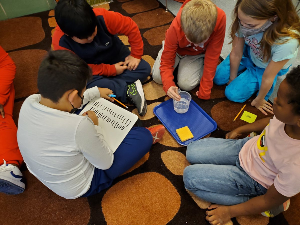 Ms. Epperson's third graders conduct a humidity experiment while science supervisor Mr. LeCompte assists!