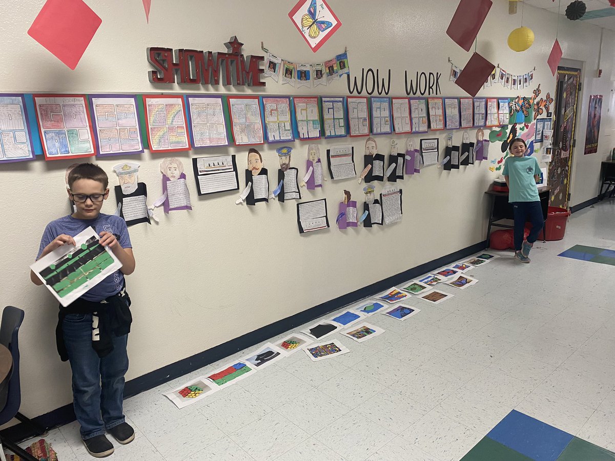 Students showing off their mosaics for the Shape Museum at Stop, Drop and Make!