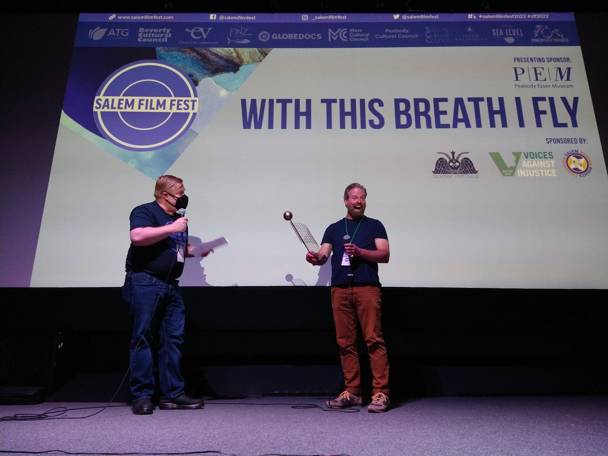 Last night this happened! WITH THIS BREATH I FLY wins our Jury Award. Co-Director Sam French is surprised &amp; delighted as the trophy is sprung on him prior to his Q&amp;A. Trophy created by Salem artist Scott Lanes. #salemfilmfest2022 #sff2022 shar.es/aWSUi0 via <a href="/idaorg/">International Documentary Association (IDA)</a>