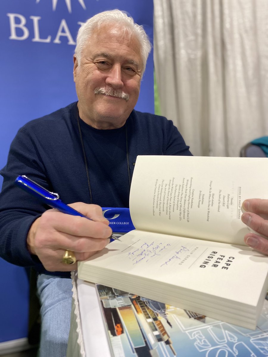 We spotted Goucher faculty emeritus Philip Gerard signing copies of “Cape Fear Rising,” art the <a href="/BlairPublisher/">Blair</a> booth at #AWP22
