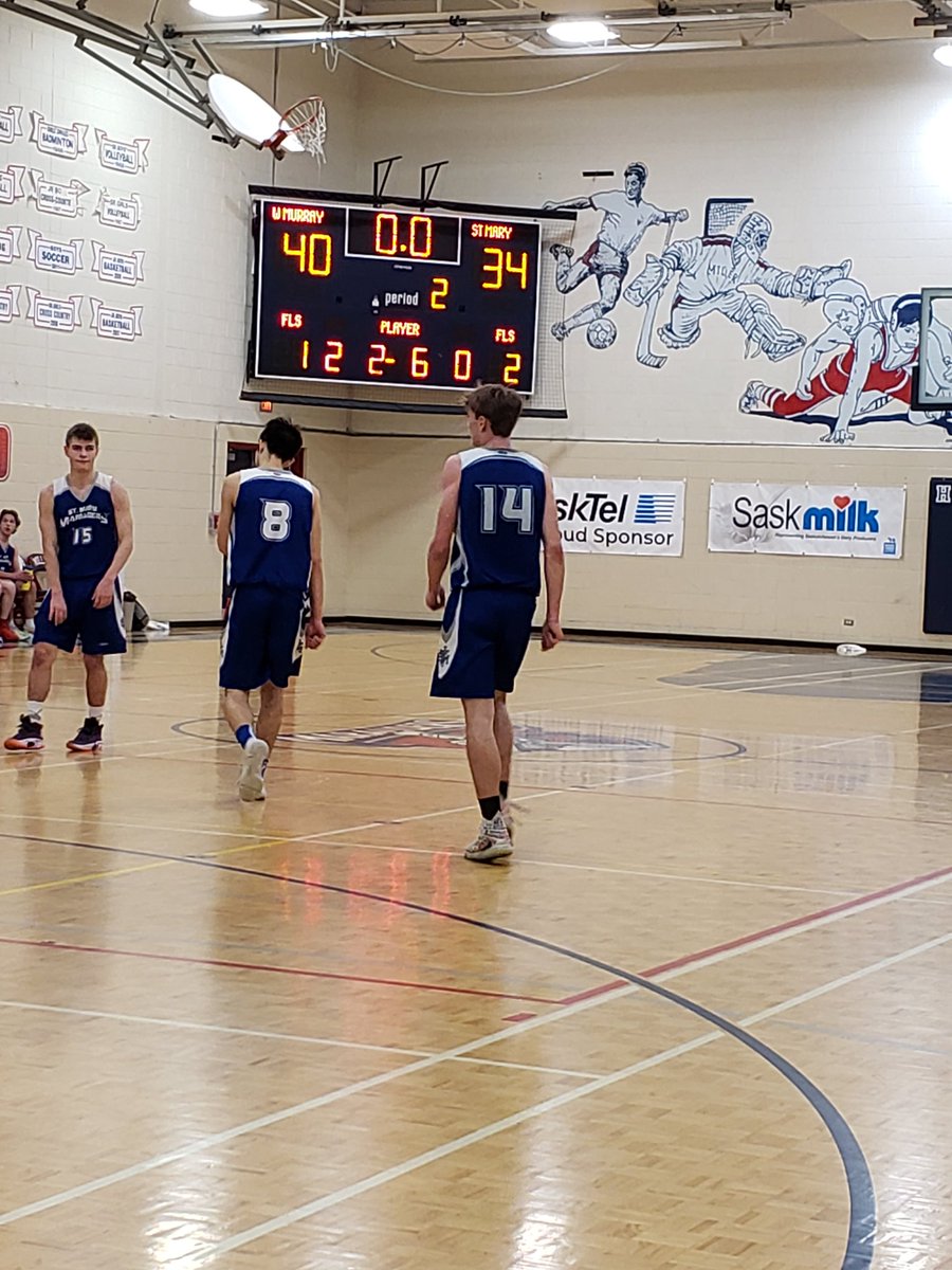 MrsSurkan's tweet photo. The 8:30am Hoopla 5A Boys game is a battle of the Marauders! Saskatoon's Walter Murray Boys are leading at the half 40-34 vs PA's St Mary. @shsaasport The host school @MillerCHS has an amazing team of volunteers, keeping the gate, score and gym running and looking great! 👏 https://t.co/0Gqn4Lmj25