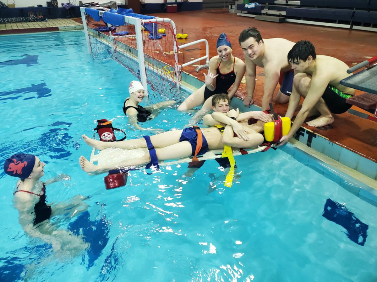 "After a close team scrimmage, the winning team got to choose who we "backboarded" to close out Spring Break practices.  #WaterPolo #SaintViator #SVHS #🦁