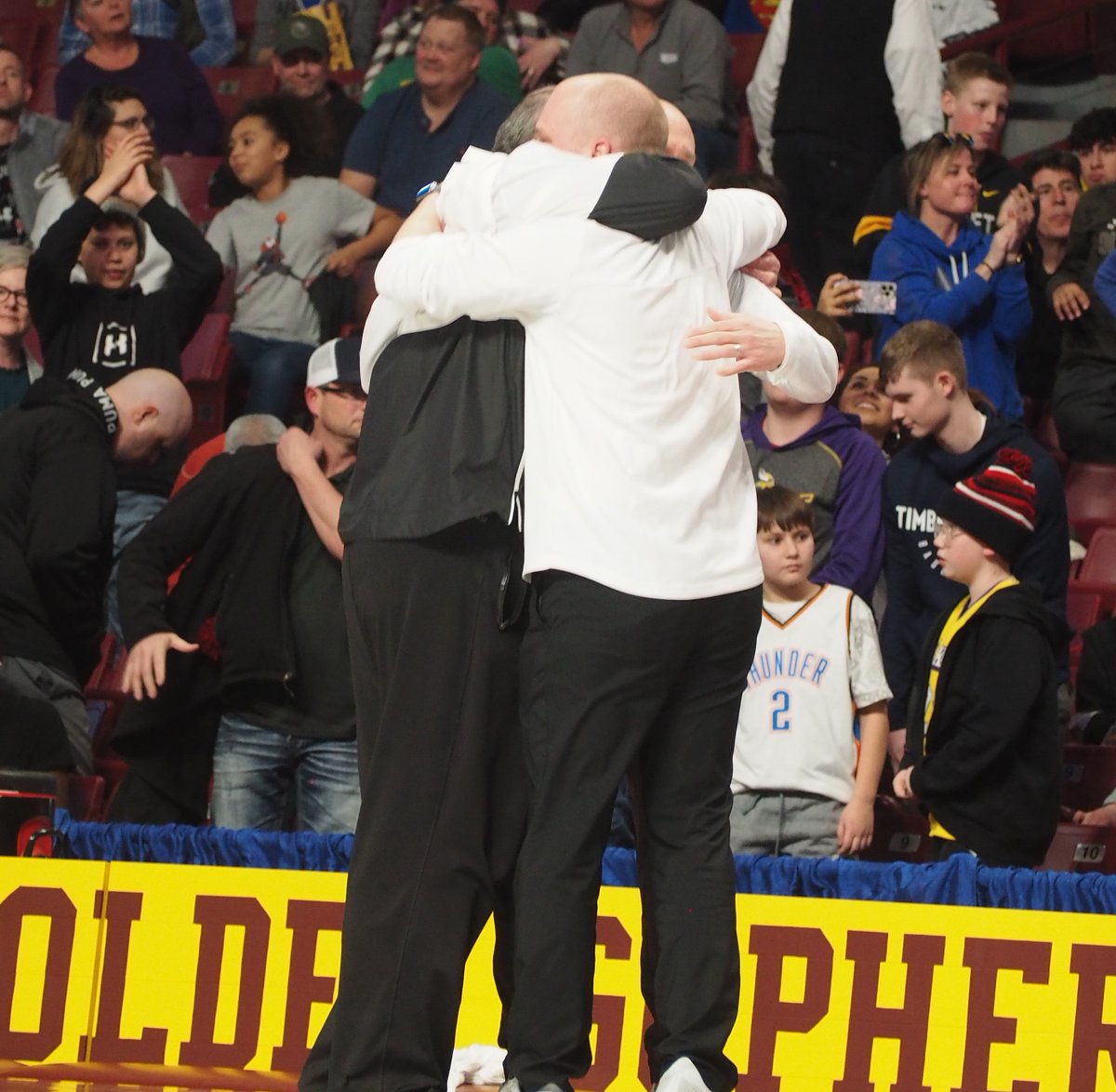 Special moment as Annandale coaches celebrate the school's first boys basketball state title.
