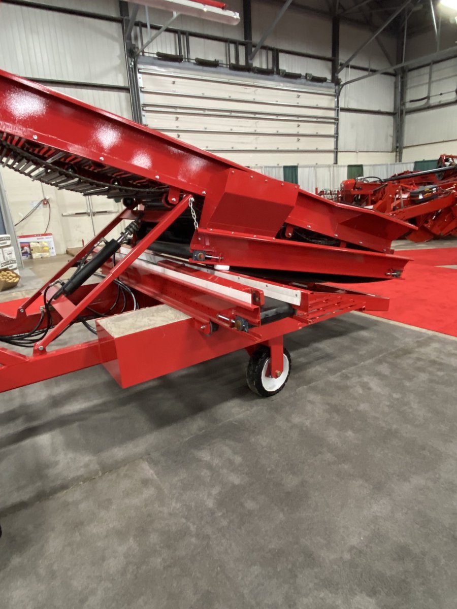 Saw this little conveyor under the bin piler at the Potato Show a week ago. Given the thousands of hours personally spent shovelling dirt around these machines, this has to be a good idea!