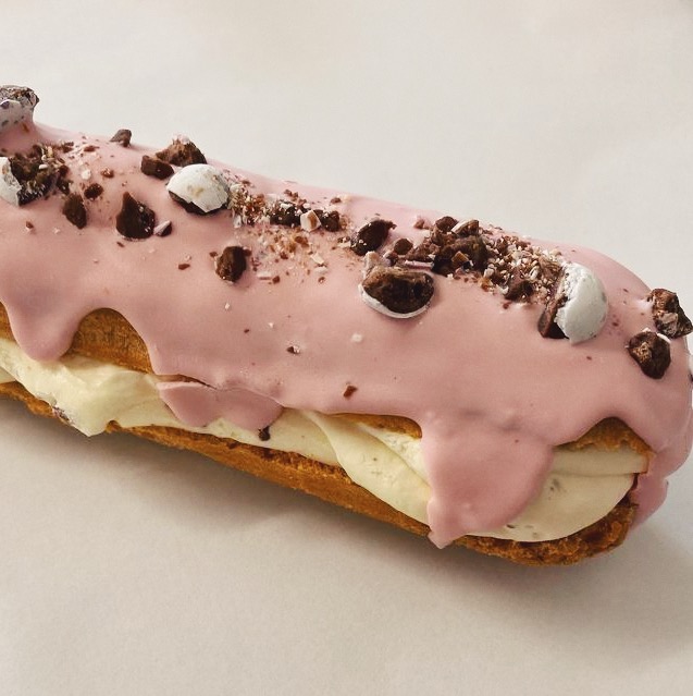 Pretty in pastels and topped with Mini Eggs 🌸🐣 Our creme patisserie eclairs are included in our Easter treat boxes. Order yours at hello@ostuni.co.uk (for somebody else, or as a treat for yourself. We won't tell!) 
#eastertreats #cremepatisserie #patisserie #eclair