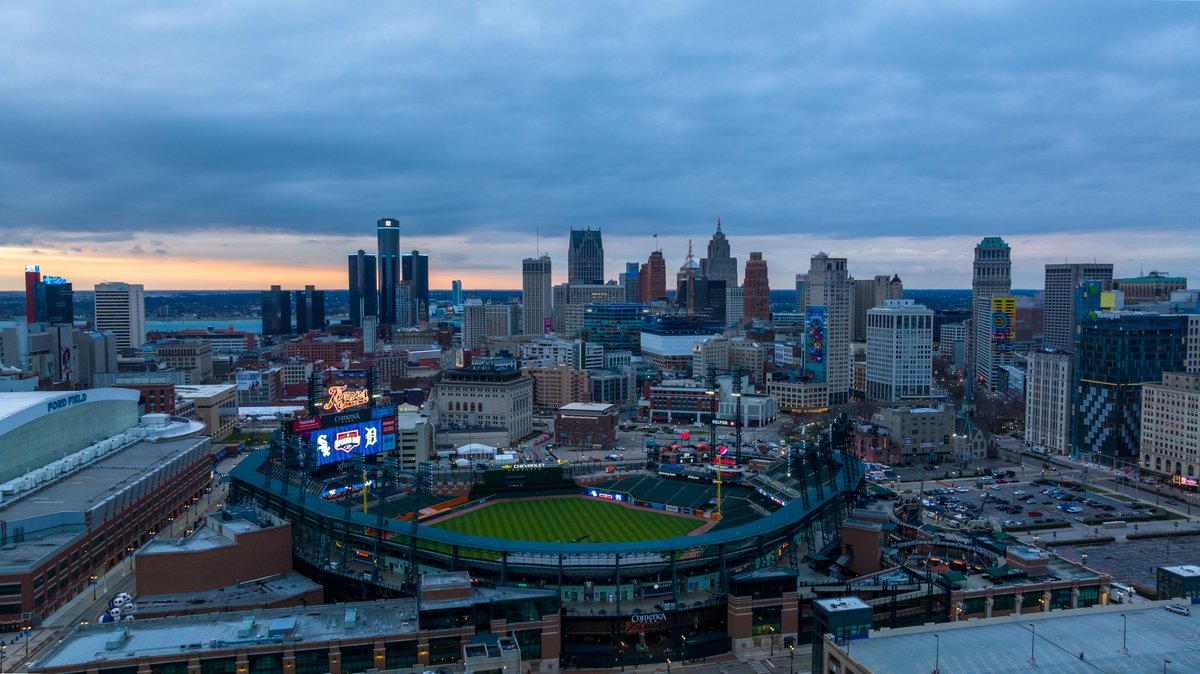 Comerica Park and the Detroit city skyline at sunrise.