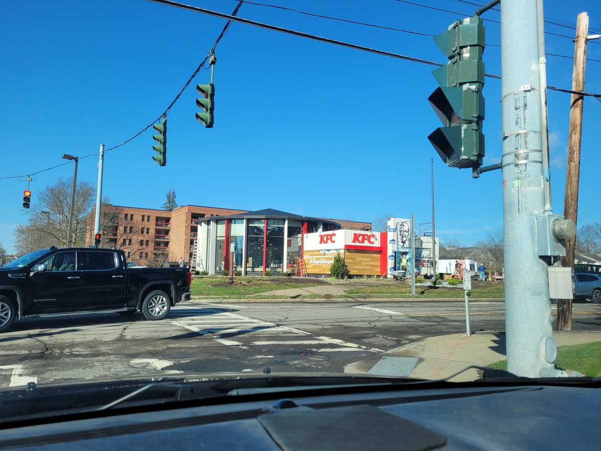 realwillarose's tweet photo. They're hanging up the Colonel at the most ridiculously designed KFC I have personally seen.

I feel like they're not following protocol...should I go over and sing the National Anthem or something? https://t.co/LfYfuzO3Uf