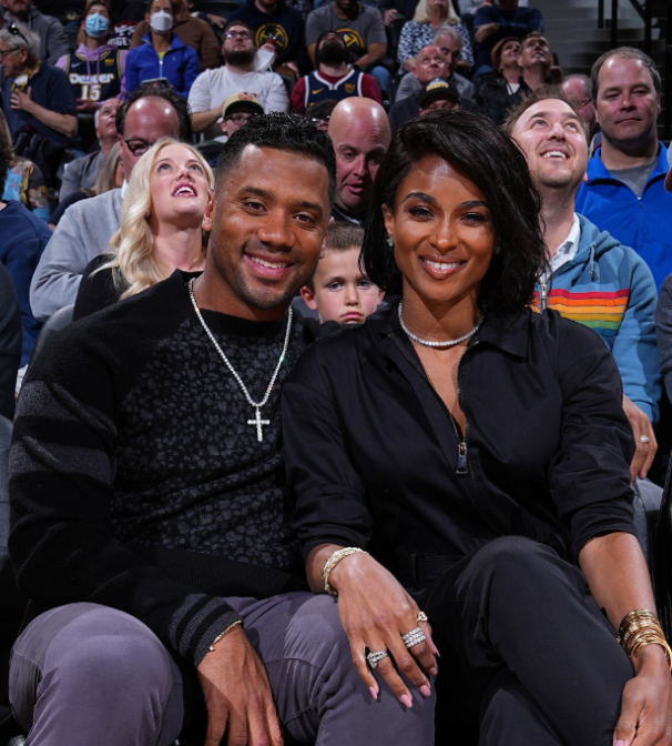 Camorooni's tweet photo. Pictured left to right, Russell Wilson, Seahawks twitter, Ciara. https://t.co/ZvNntFu3l0