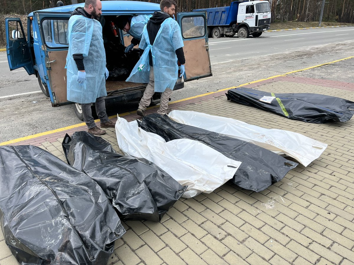 PenFarthing's tweet photo. Two old #ukraisne ambulance drivers were struggling to load the bodies of innocent civilians killed as they fled. They were shot in their cars. We stopped to assist. We all stood there for a while then shook hands &amp; walked off in silence. #putin is pure evil #NowzadUkraine https://t.co/d2IRyYSZIx