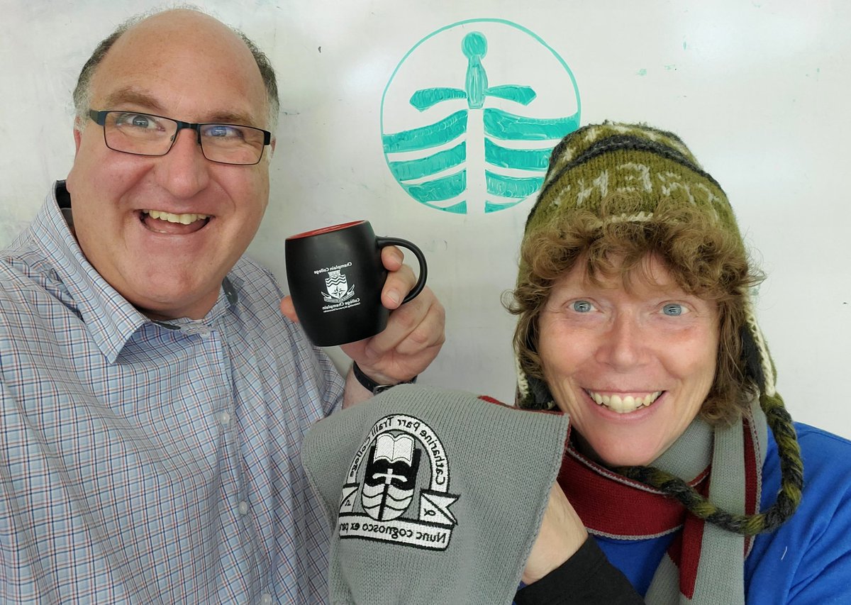 BruceEmmerton's tweet photo. Celebrating #TrentDay with @TrentUniversity @TrentAlumni colleagues. My @ChamplainTrentU mug outshines Cathy's @Traill_College scarf any day! Trent logo drawing courtesy of one of our students. Hi from Kingston to all alumni!  @TrentUSoE https://t.co/71m2TNliub
