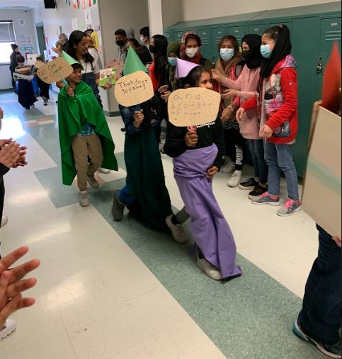 AIC_Dual's tweet photo. Secondary students cheered through the hallways as the elementary school students paraded for “Living Literature Day,” where students dressed up like a literary character! @AlbanyENL #allinforalbany @albanyschools https://t.co/uTjbG88j5o
