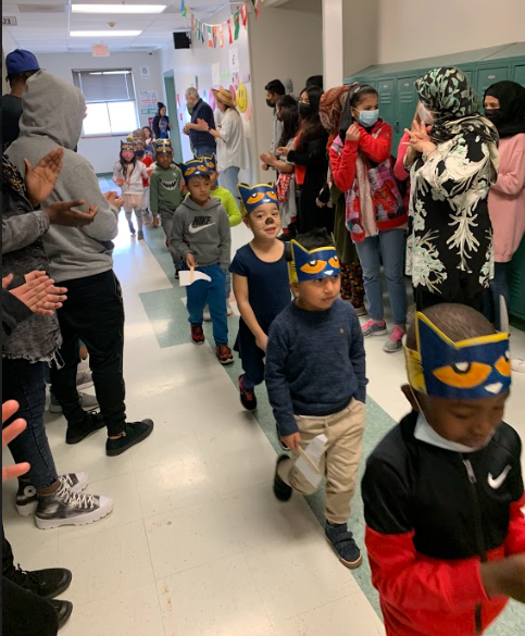 AIC_Dual's tweet photo. Secondary students cheered through the hallways as the elementary school students paraded for “Living Literature Day,” where students dressed up like a literary character! @AlbanyENL #allinforalbany @albanyschools https://t.co/uTjbG88j5o