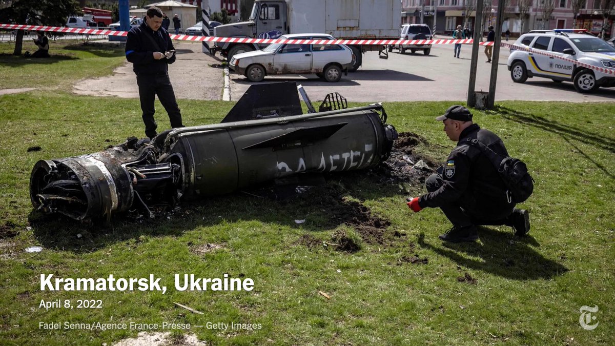 nytimes's tweet photo. Ukrainian police inspected the remains of a large rocket with the words “for our children” in Russian next to the Kramatorsk train station. At least 50 people were killed and many more wounded in a rocket assault Friday morning. https://t.co/V4zTjgyQQv https://t.co/pBTli4Fp6y