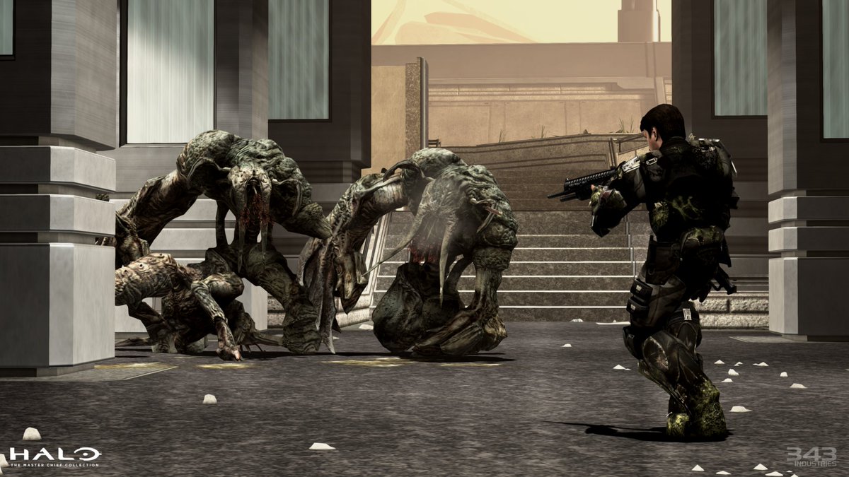 An O D S T pointing his shotgun at the Flood.