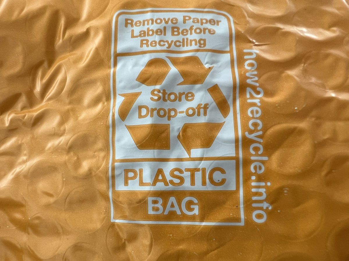 quarklemotion's tweet photo. The team that made this recycling guide really needs to collaborate more with the team selecting the glue for the shipping labels! #amazon https://t.co/xaDXwQCJRn