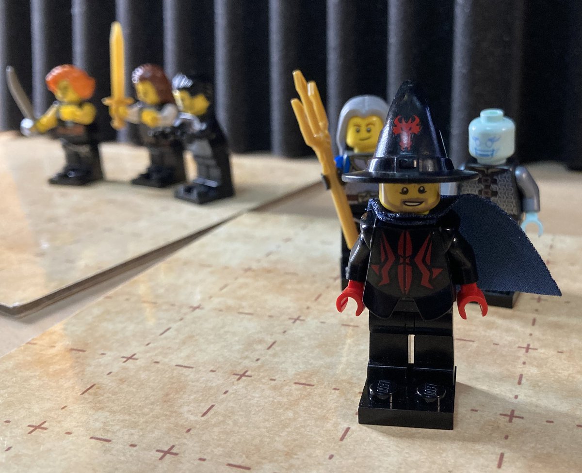 Our heroes with a mysterious wizard in front?