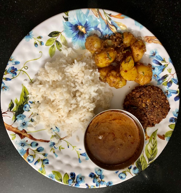 pensivesmaiitm's tweet photo. a simple Saturday lunch. you are welcome to taste my cooking
garlic gravy. aloo fry, vada, brown+white rice
not all vada's look this round!
 #weekendcook https://t.co/vRiNUbBTVS