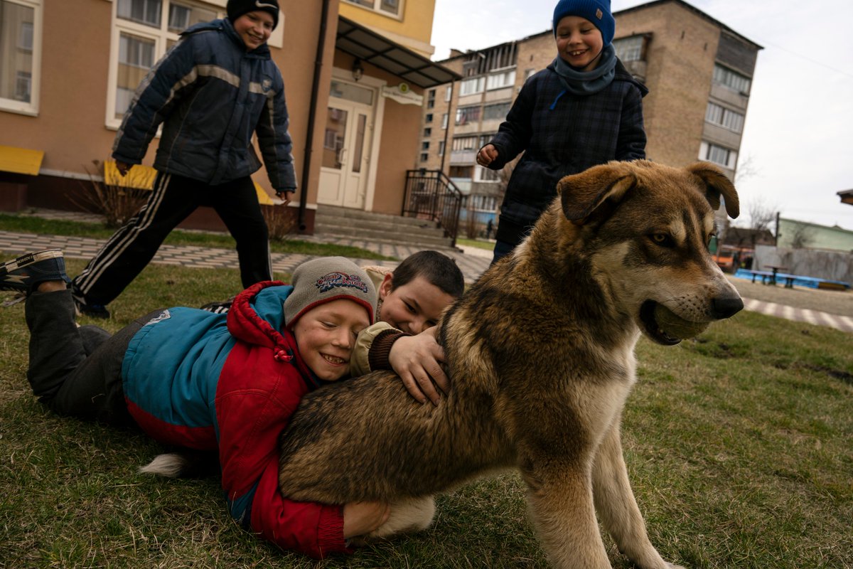 Kids in war-torn #Bucha are playing with a dog.

Photo - AP Photo/Rodrigo Abd