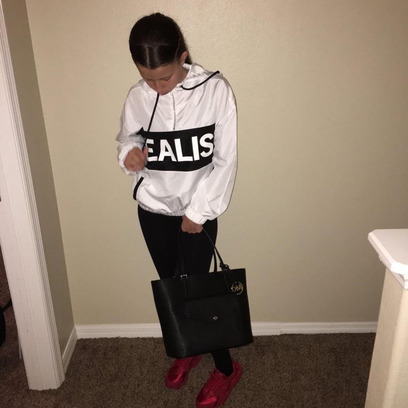 cesarfinder's tweet photo. Girl with white sweater on beige wall stan twitter meme musically baby ariel https://t.co/Exip2vD0Y7