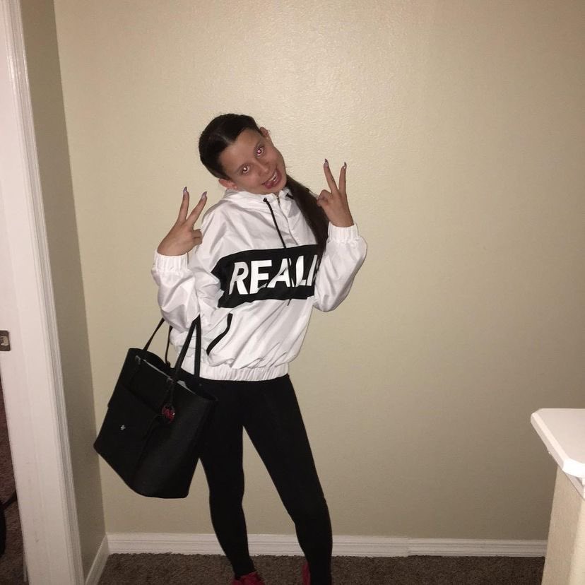 cesarfinder's tweet photo. Girl with white sweater on beige wall stan twitter meme musically baby ariel https://t.co/Exip2vD0Y7