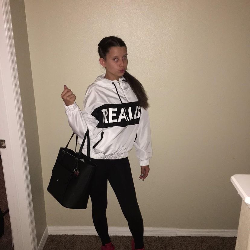 cesarfinder's tweet photo. Girl with white sweater on beige wall stan twitter meme musically baby ariel https://t.co/Exip2vD0Y7