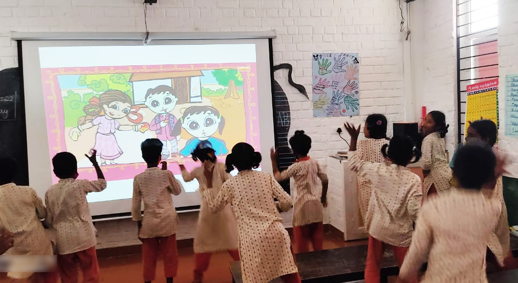 ishavidhya's tweet photo. For students of classes 1-4 who need extra support in English, we conduct #PowerEnglish classes with a ‘Total Physical Response’ activity where they listen to music, read stories, and enact what they see on video. This keeps students focused and improves their language skills. https://t.co/25OpWt66j3
