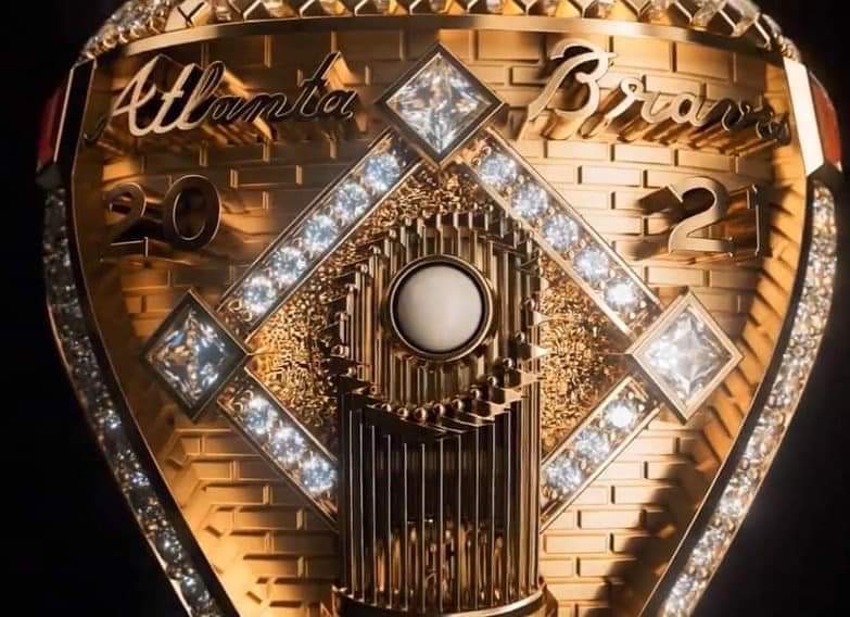DoctorBobble's tweet photo. Excuse me while I go sell my house to buy one of these. 

150 diamonds in the A, 755 total diamonds, 44 emerald cut diamonds, 18.71k gold, 11 rubys inside of the ring to show all the braves World Series home runs working lights in the ring, and a Joc pearl. https://t.co/9YZv2KhjrX